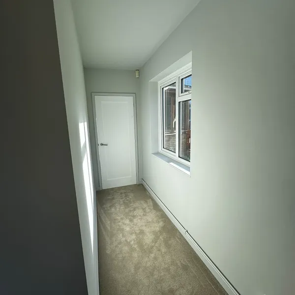 Freshly decorated hallway in the annex, with a window along one side