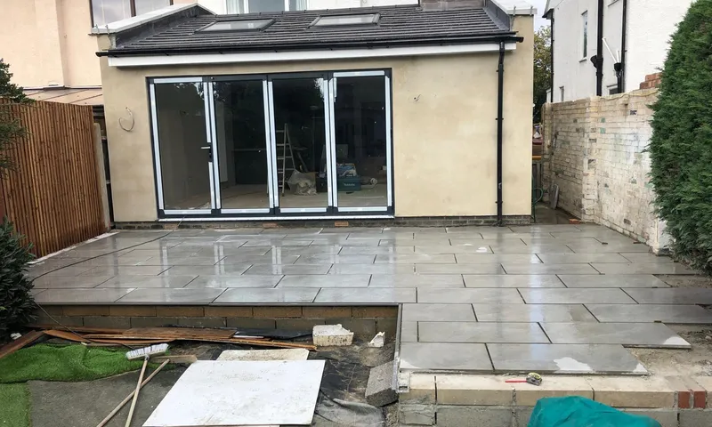 Single-storey rear extension on a semi-detached house, with a tiled roof, two rooflights and bifold doors